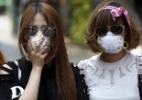 Turistas e moradores adotam máscaras para evitar a Mers na Coreia do Sul - Kim Hong-Ji/ Reuters