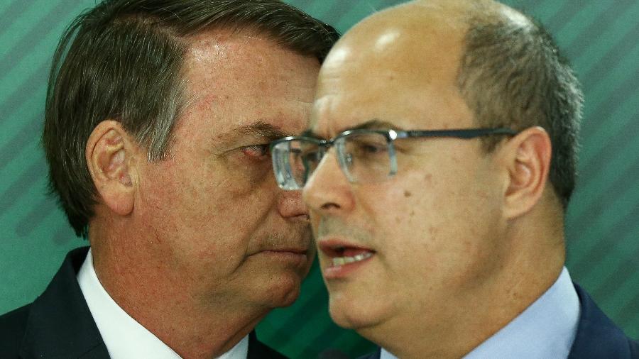 O presidente Jair Bolsonaro, acompanhado do governador do RJ Wilson Witzel - Pedro Ladeira/	Folhapress