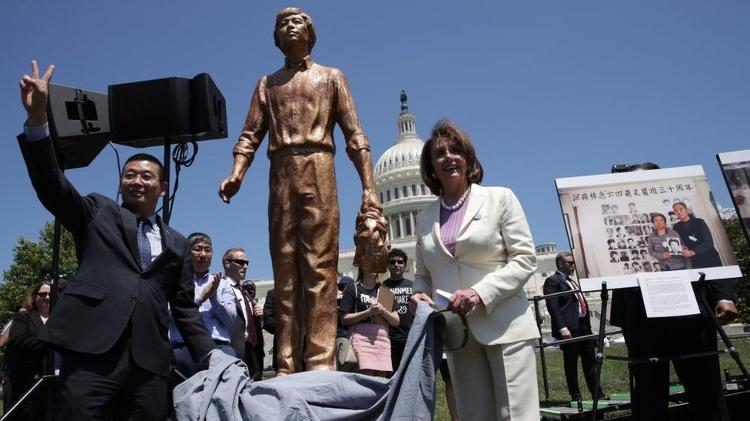 Pelosi unveils the Tiananmen Square protester statue at a rally with Chinese dissidents in 2019 - Getty Images - Getty Images