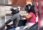 Vídeo mostra mulher comendo marmita na garupa de moto em movimento em PE - Reprodução de vídeo