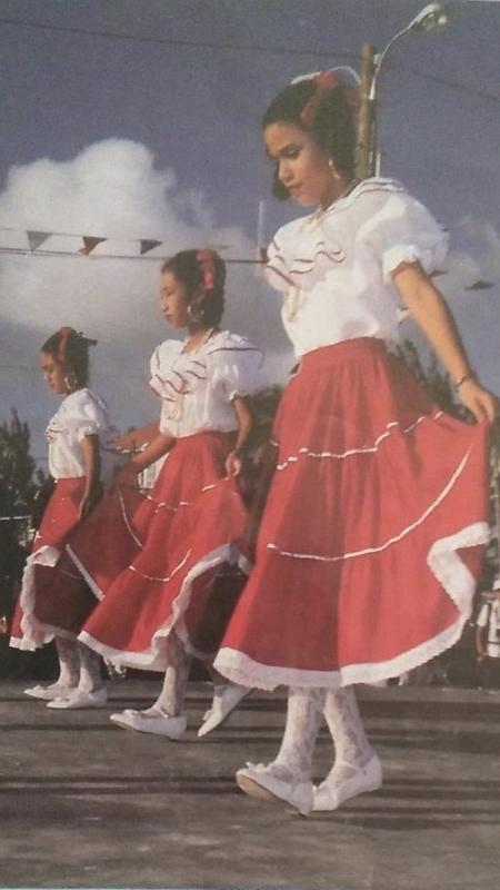 Jordana Riveroll, Vanesa Vasquez Rancharan and Andrea Garcia-Riveroll pictured dancing for the Queen during a 1994 royal visit to Belize