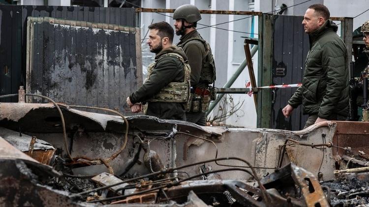 President Zelensky (centre, without helmet) visited the town of Bucha earlier this month - BBC - BBC