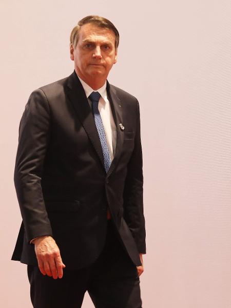 28.jun.2019 - Bolsonaro chega para a foto oficial do G20 - Ludovic Marín/AFP