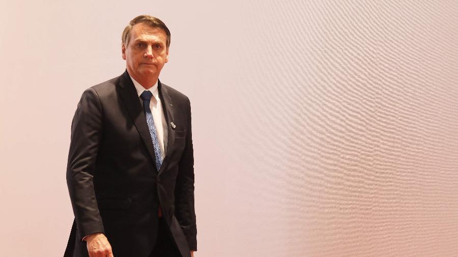 Jair Bolsonaro chega para a foto oficial da cúpula do G20, que está acontecendo em Osaka, no Japão -  ludovic MARIN / AFP