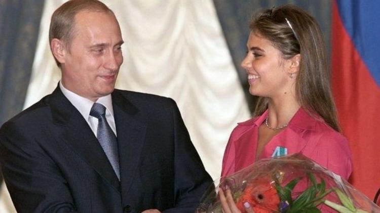 Putin and Kabaeva at a ceremony in 2001 - AFP - AFP