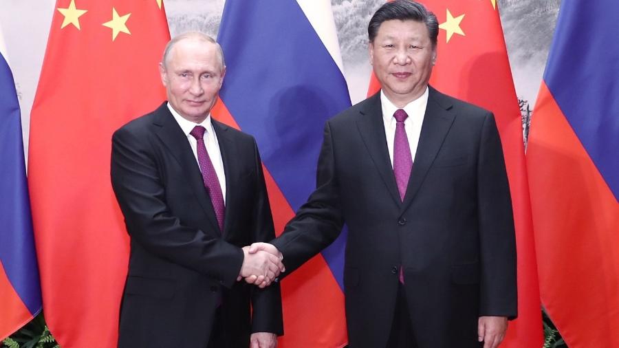 Presidente chinês Xi Jinping e o presidente russo Vladimir Putin em Pequim, na China - Xinhua/Ju Peng