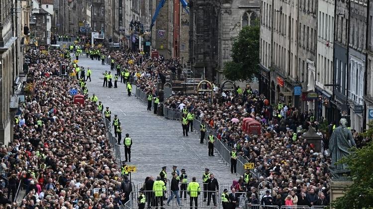 Crowds wait to watch Queen Elizabeth II's funeral procession in Edinburgh, Scotland