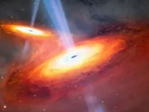 Sem querer e inédito: astrônomo acha 2 poderosos buracos negros em colisão