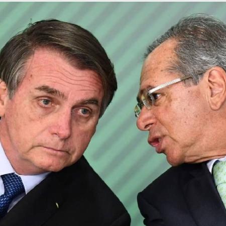 Bolsonaro e Paulo Guedes; Senado não gostou da reação do ministro sobre decisão de derrubar veto presidencial - Evaristo Sá/AFP/24-05-2019