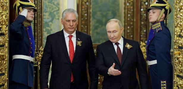 Vladimir Putin e o presidente de Cuba , Miguel Diaz-Canel, durante reunião em Moscou, em 9 de maio