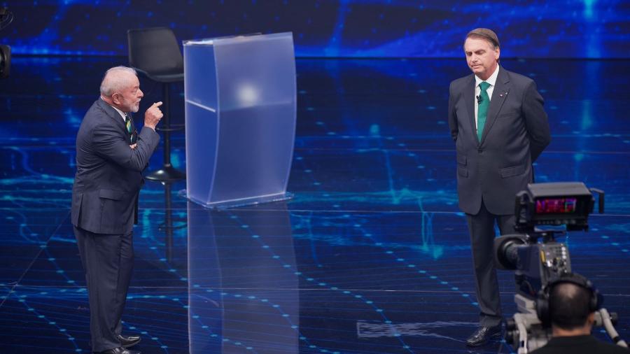 O ex-presidente Luiz Inácio Lula da Silva e presidente Bolsonaro participam de debate na TV Bandeirantes - Marlene Bergamo / Folhapress 