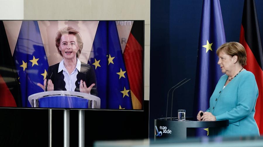 Ursula von der Leyen, falando ao lado da chanceler alemã Angela Merkel via vídeo, disse que os problemas pré-coronavírus não desapareceram - Kay Nietfeld/Pool via Reuters