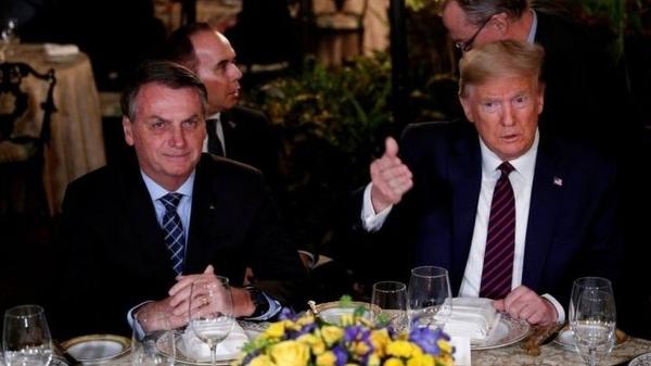 Jair Bolsonaro em jantar com Donald Trump em março de 2020