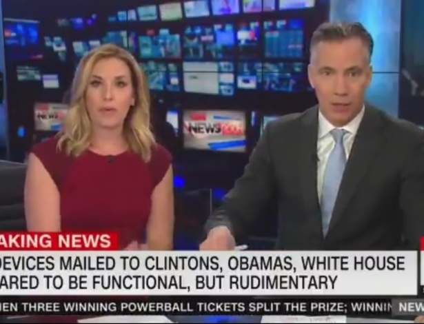 Âncoras Poppy Harlow e Jim Sciutto, da CNN, interrompem transmissão e abandonam prédio da emissora após alerta de bomba no local - Reprodução/CNN