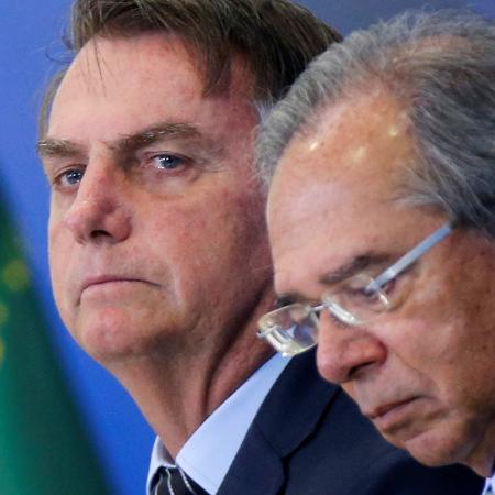 Presidente Jair Bolsonaro e ministro da Economia, Paulo Guedes - ADRIANO MACHADO