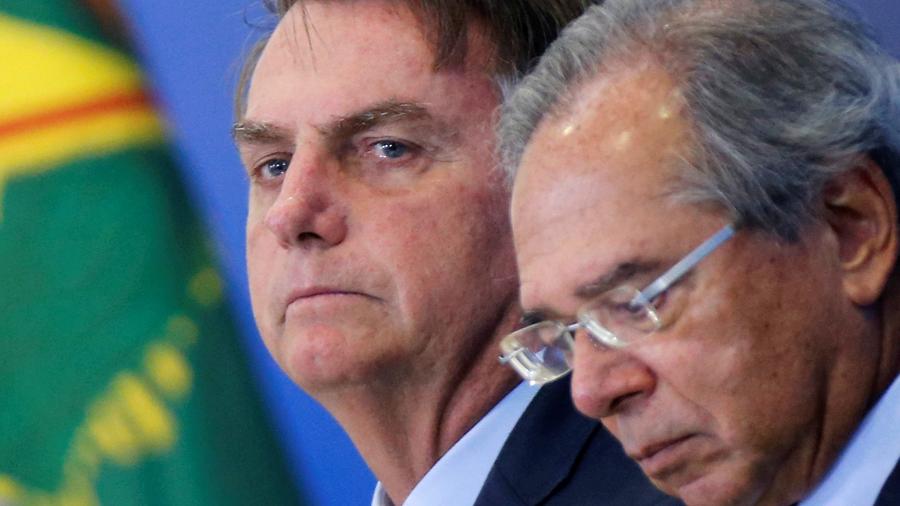 Presidente Jair Bolsonaro e ministro da Economia, Paulo Guedes, durante evento no Palácio do Planalto - ADRIANO MACHADO