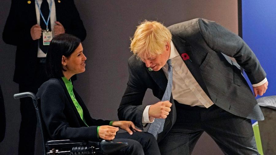 Karine Elharr e Boris Johnson durante a COP26 - Alberto Pezzali/AFP