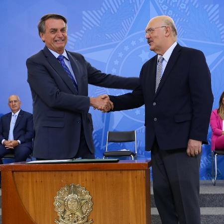 Bolsonaro (à esquerda) e Milton Ribeiro em evento no Planalto - Clauber Cleber Caetano/Presidente da República