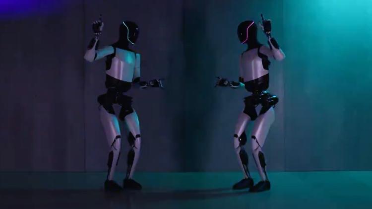 Dois robôs Optimus Gen 2, da Tesla, dançando