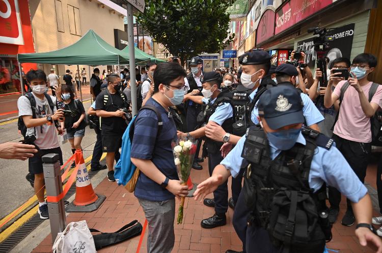 Jun 04.22 - Police detained Chiu Yan-loy, former member of the Hong Kong Alliance standing committee, near the traditional meeting place of Hong Kongers commemorating the 1989 Tiananmen raid - PETER PARKS/AFP - PETER PARKS/AFP