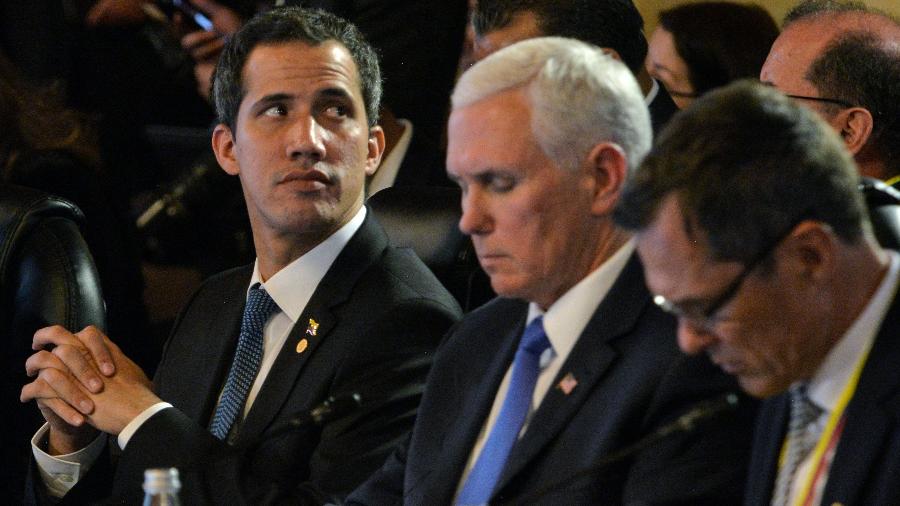 Juan Guaidó --que aparece na foto ao lado de Mike Pence, vice-presidente dos EUA (dir.)-- pediu o acionamento do tratado - Diana Sanchez - 25.fev.2019/AFP