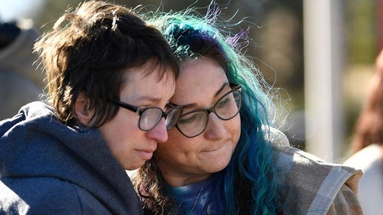 People mourn those who died at the scene of the attack - Getty Images - Getty Images