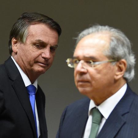 22.out.2021 - O presidente Jair Bolsonaro e o ministro da Economia, Paulo Guedes - Evaristo Sá/AFP