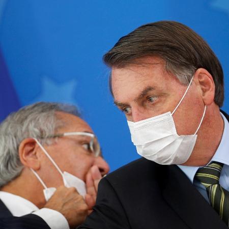 Presidente Jair Bolsonaro e Ministro da Economia, Paulo Guedes, durante coletiva de anúncio de medidas contra o coronavírus - ADRIANO MACHADO