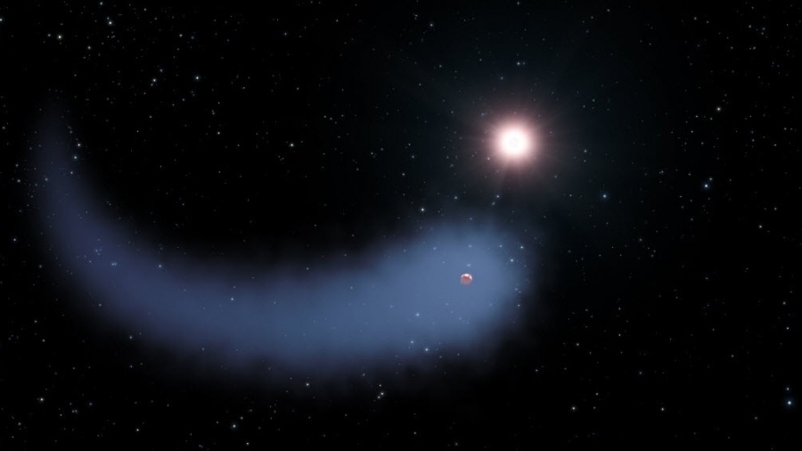 Astrônomos descobriram uma imensa nuvem de hidrogênio ao redor do planeta Gliese 436b, em órbita com uma estrela próxima. A enorme cauda gasosa do planeta é cerca de 50 vezes o tamanho da estrela-mãe - NASA/ESA/STScI