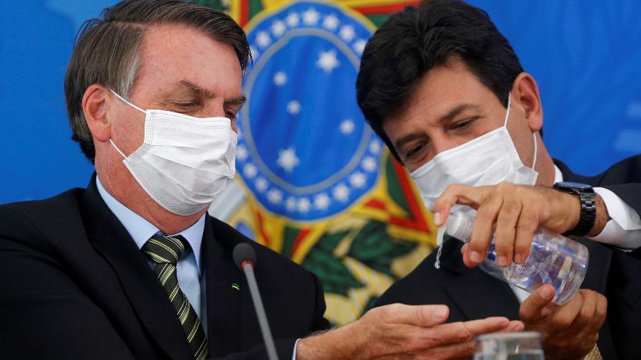 Presidente Jair Bolsonaro e ministro da Saúde, Luiz Henrique Mandetta, durante entrevista coletiva em Brasília - 