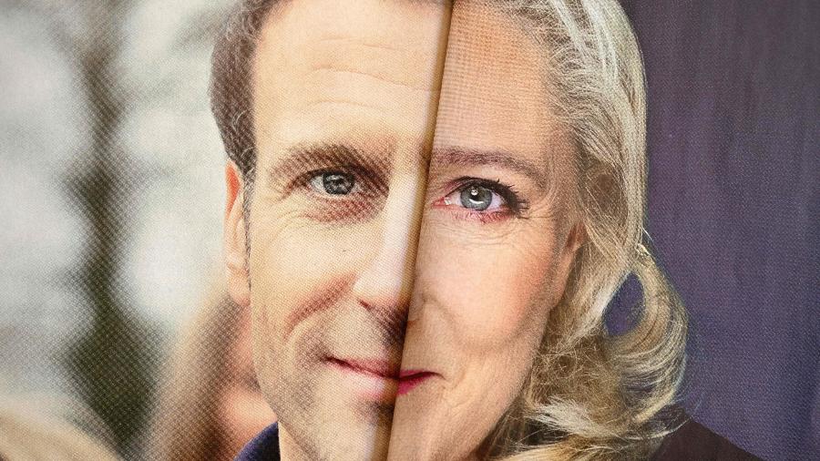 Foto, com base nos cartazes de Emmanuel Macron e Marine Le Pen, mostra os dois candidatos a presidente da França - 6.abr.2022 - Nicolas Tucat/AFP