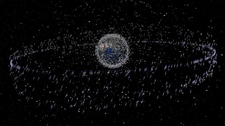 Impressão artística de satélites rodeando o planeta Terra Impressão artística de satélites rodeando o planeta Terra