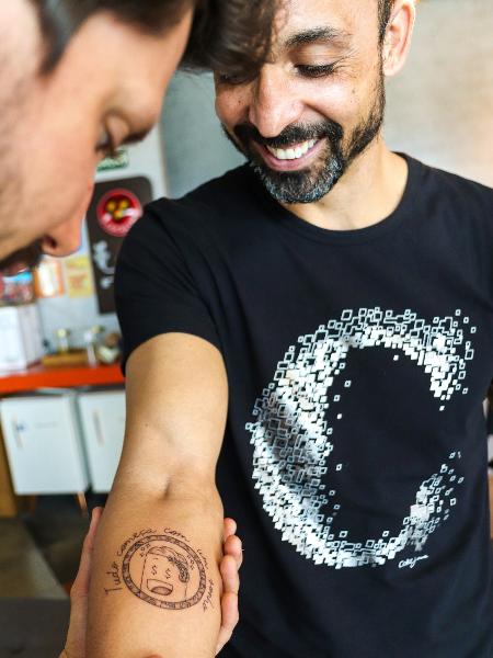 Gilsemir Pereira fez a tatuagem da moeda digital da PremiaPão no antebraço direito - Arquivo pessoal