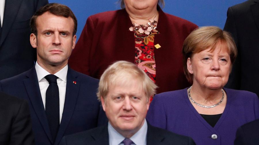 4.dez.2019 - Macron, Johnson e Merkel durante o encontro da Otan na Inglaterra - Adrian Dennis/AFP