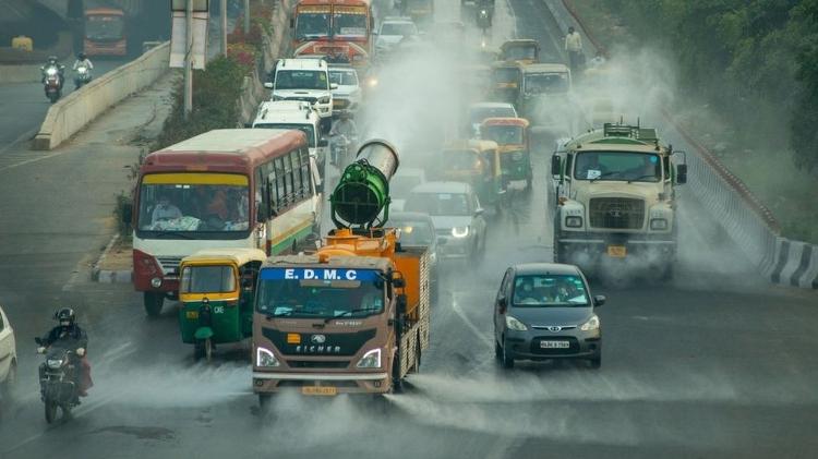 Do the measures taken in Beijing and other cities conflict with brutal solutions in places like New Delhi?  In this 2020 photo, a city truck sprays water on the streets to neutralize pollutant particles in the air - Getty Images - Getty Images