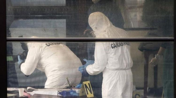 Forensic teams examine the scene of the attack - EPA - EPA
