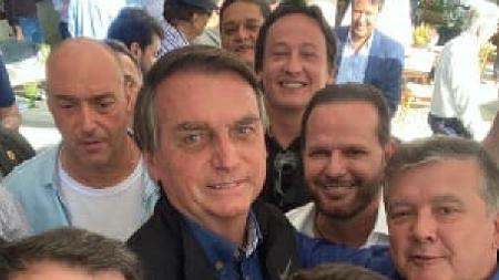 Atilio Rovaris (no alto) esteve em um encontro de empresários do agronegócio com o presidente Jair Bolsonaro (PL) em maio deste ano em Brasília - Reprodução - Reprodução