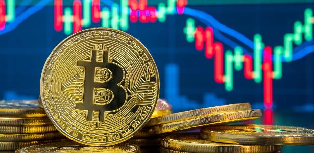 Bitcoin pode cair ainda mais? Entenda o risco que contagia a criptomoeda - UOL Economia