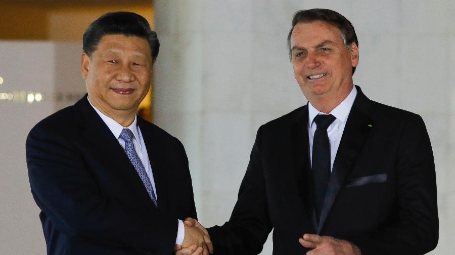13.nov.2019 - Xi Jinping e Jair Bolsonaro em encontro dos BRICS, em Brasília -  Sergio LIMA / AFP