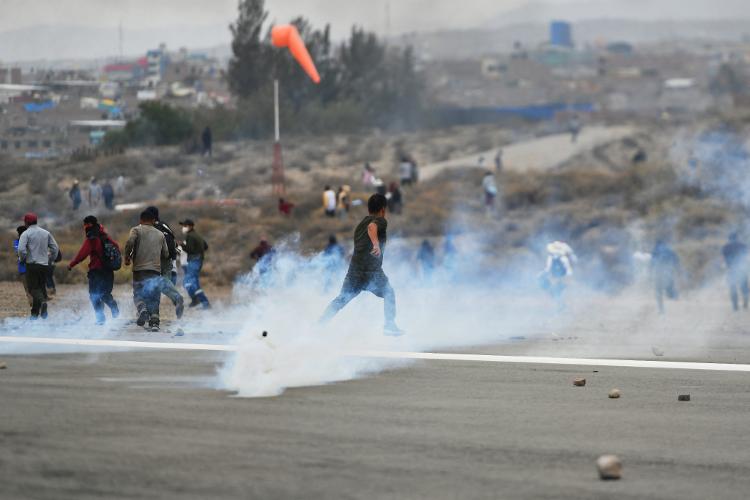 December 12.22 - Protesters escaped from police fired tear gas as they occupied Alfredo Rodriguez Ballon International Airport after new Peruvian President Dina Boluarte announced her intention to introduce a bill to parliament to advance the general elections scheduled for April 2026 .  in Arequipa, Peru until April 2024 - DIEGO RAMOS/AFP - DIEGO RAMOS/AFP