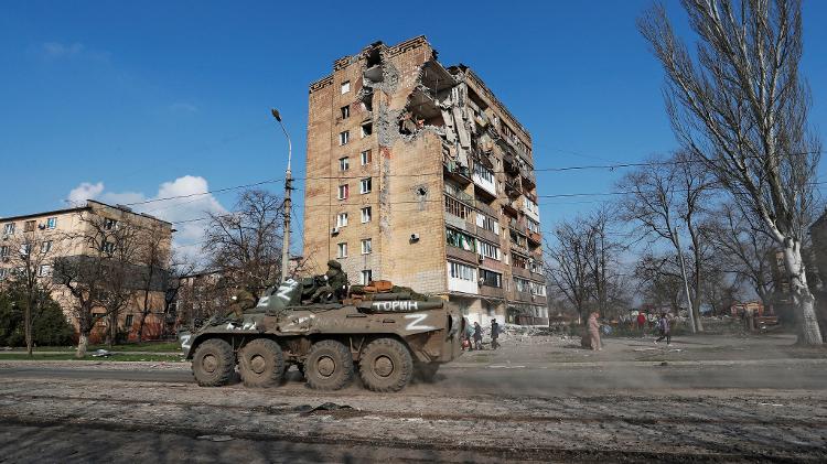 Pro-Russian troops in an armored vehicle in Mariupol, Ukraine - Alexander Ermochenko/Reuters - Alexander Ermochenko/Reuters