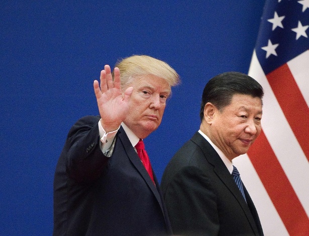 Donald Trump com o presidente chinês Xi Jinping em Pequim, na China - Nicolas Asfour/AFP