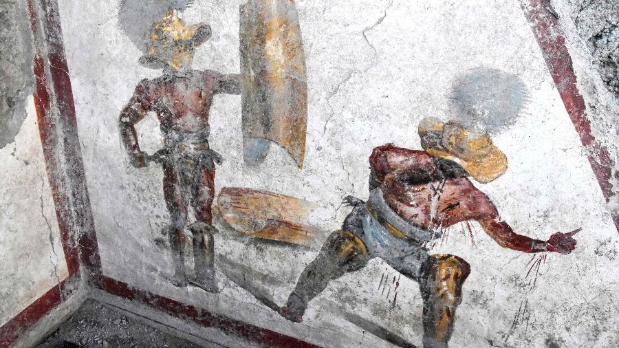 11.out.2019 - Afresco encontrado em Pompeia retrata enfrentamento entre gladiadores - AFP