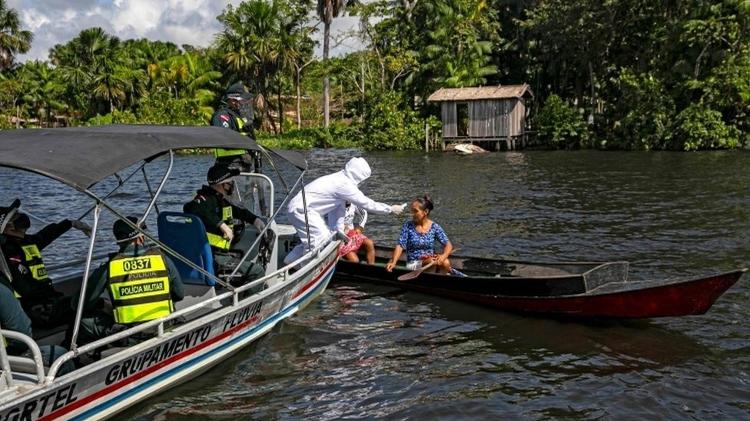 Temperatura profissional de mulher na Ilha de Marajó, no Pará - TARSO SARRAF / AFP via Getty Images - TARSO SARRAF / AFP via Getty Images