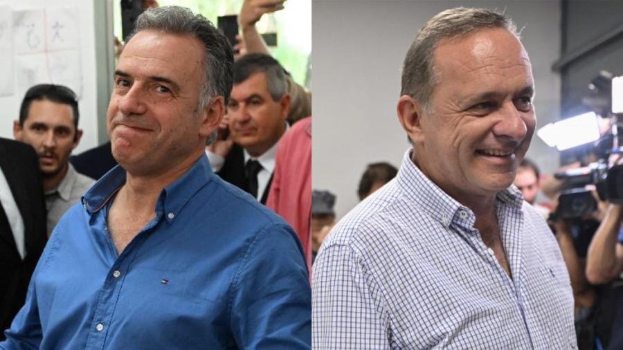 Yamandú Orsi (à esq.) e Álvaro Delgado (à dir.) votaram neste domingo (27) no Uruguai