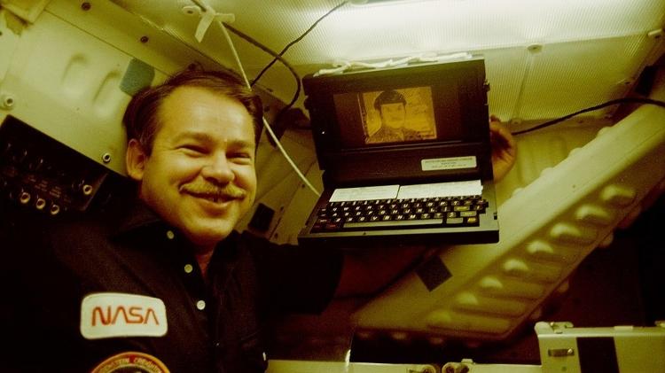 A 1985 photo of astronaut John O. Creighton next to a NASA laptop - NASA - NASA
