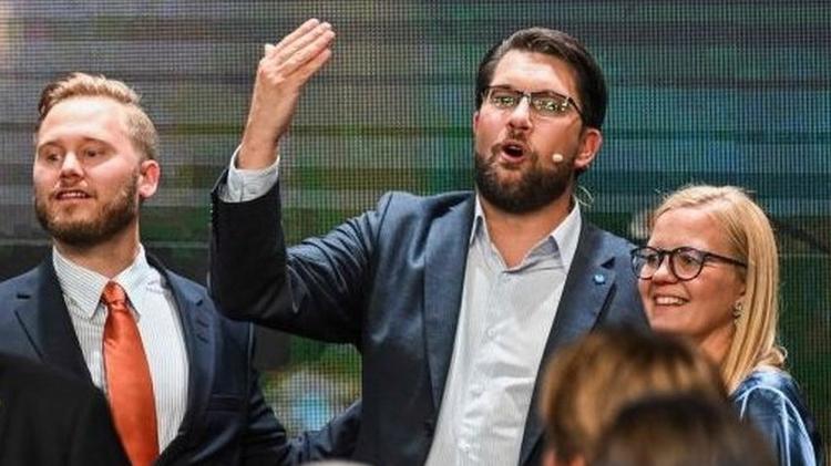 Party leader Jimmie Akesson (centre) delivers a speech on Sunday - Getty Images - Getty Images