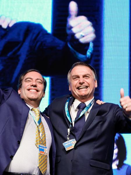 Presidente Jair Bolsonaro ao lado do presidente da Caixa, Pedro Guimarães - Isac Nóbrega/PR