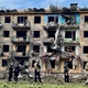 April 30, 2022 - Ukrainian army inspects the area where the missile attack took place in front of a damaged residential building during the Russian occupation in Dobropillia in the Donetsk region - Jorge Silva / Reuters