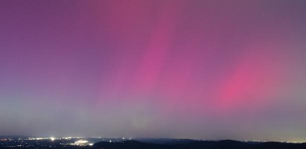 The United States experiences a rare northern aurora caused by a solar storm; photo